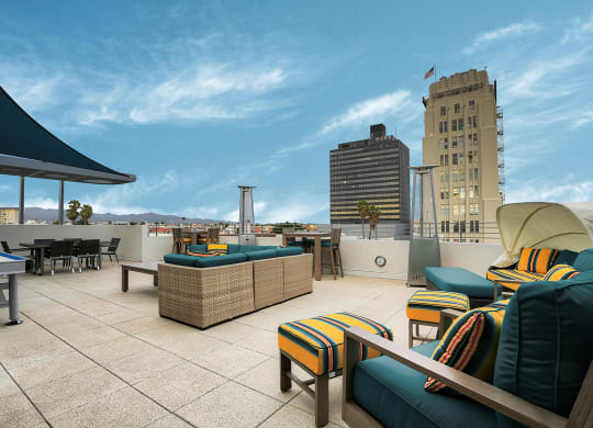 Enjoy the rooftop lounge at 5550 Wilshire at Miracle Mile by Windsor with views of the Hollywood Sign in Los Angeles 90036