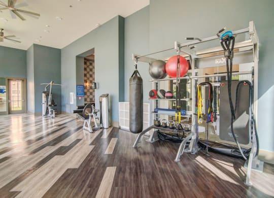 Fitness center with weights and other equipment at Windsor Lakeyard District in the Colony TX
