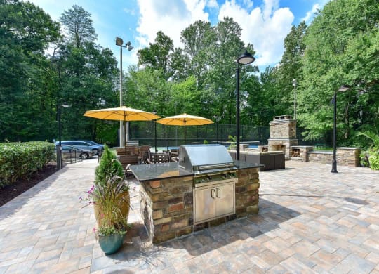 Windsor Oak Creek - Grilling Station with yellow umbrellas in Fairfax VA
