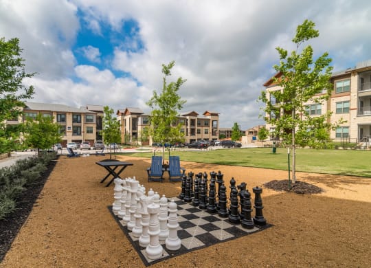 Outdoor Recreation Area with large chess board at Windsor Lakeyard District in the Colony TX