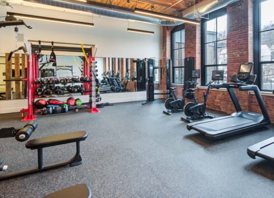 Gym with cardio equipment and weights at Windsor Radio Factory, Melrose, MA