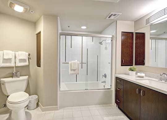 Modern bathrooms with ceramic tile and oversized tubs at 5550 Wilshire at Miracle Mile by Windsor, CA 90036
