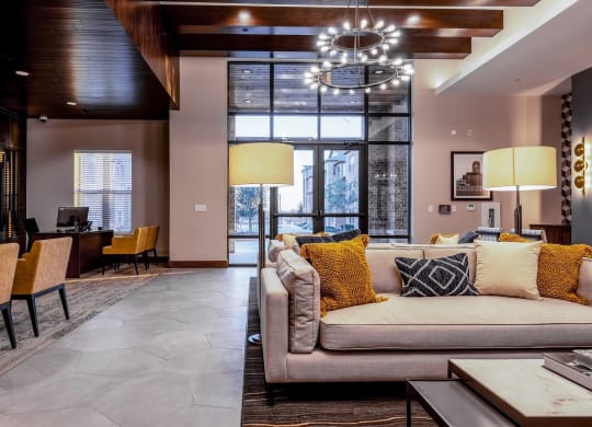 Leasing Office and Clubhouse with White Armchairs on Area Rug with Coffee Tables at Windsor Castle Hills, Carrollton, 75010