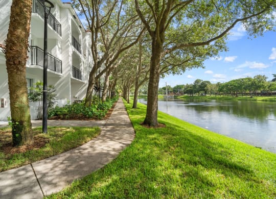 Great landscaping, paths, and onsite lake at Windsor Coral Springs, Coral Springs, FL