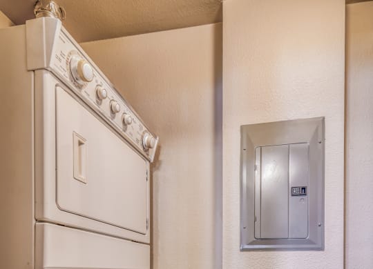 A laundry room with a washer and dryer at The District, Denver, CO