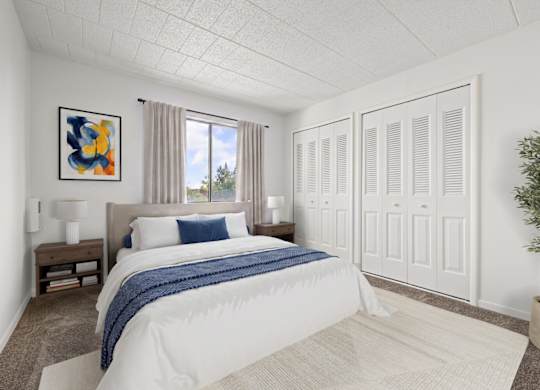 A bedroom with a large bed and a painting on the wall.