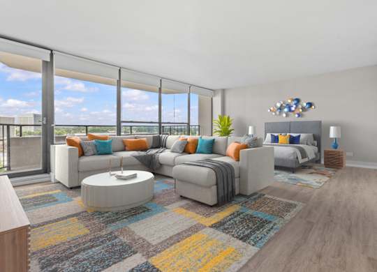 A modern living room with a large grey sofa and a coffee table.