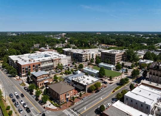 an aerial view of a city with buildings and trees