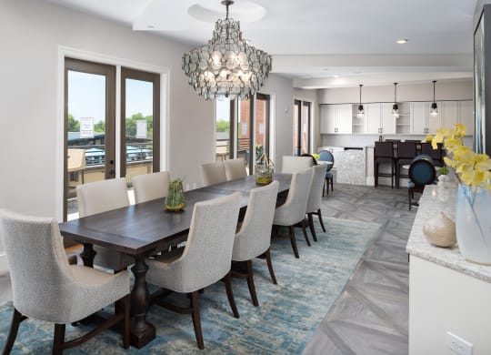 a dining room with a long table and chairs