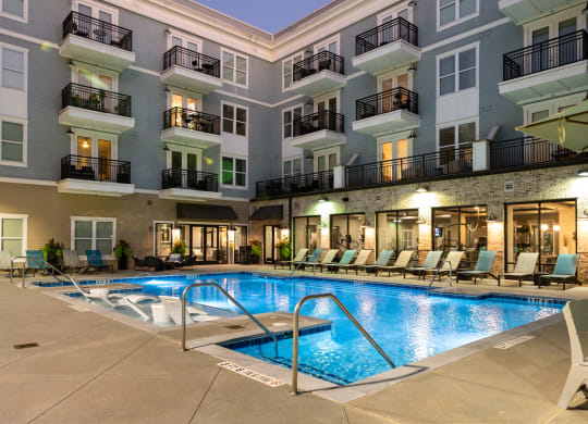 a swimming pool in the middle of an apartment building