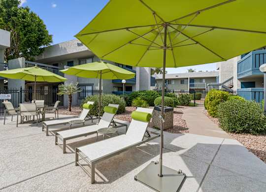 A sunny day at the outdoor seating area with green umbrellas.