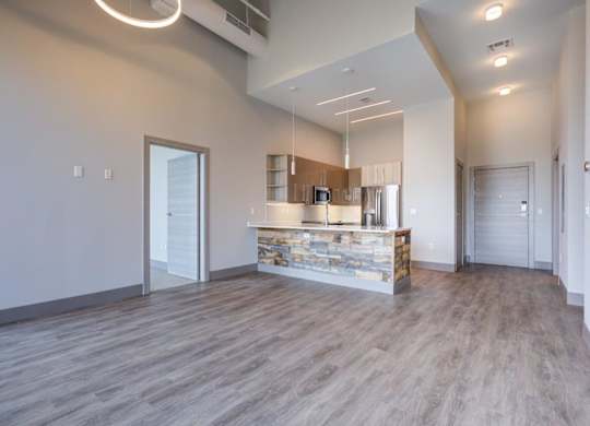 A kitchen area with a countertop and cabinets.
