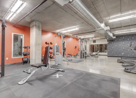the gym at the district at highland village apartments
