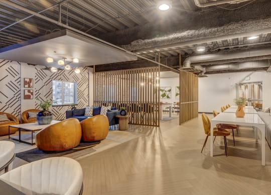a living room and dining room with a table and chairs