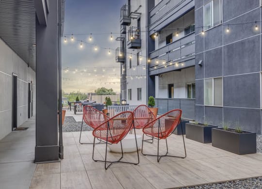 a communal area with chairs and tables in an office building