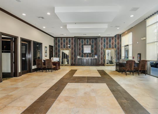 a large room with a large tile floor and a large mirror on the wall