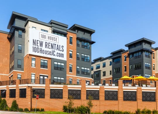 a building with a sign that reads 100 house new rentals at 100 House Apartments, New Jersey, 07310