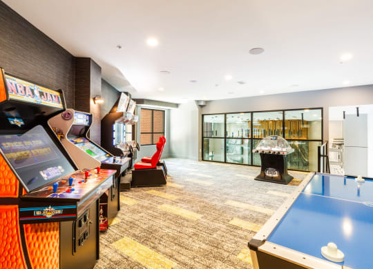 a games room with a pool table and a fireplace at 100 House Apartments, Jersey City , 07310