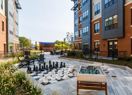 a chess board in the middle of an apartment courtyard at 100 House Apartments, Jersey City , 07310