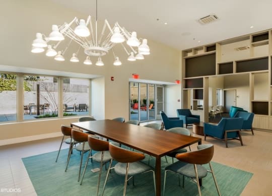 a conference room with a long table and chairs and a large window with a view at Carver and Slowe Apartments, Washington, Washington, DC 20001