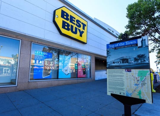 a best buy sign on the side of a building at The Saratoga Apartments, Washington