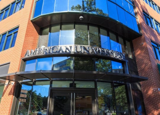 a tall building with a sign on the front of it at The Saratoga Apartments, Washington, DC