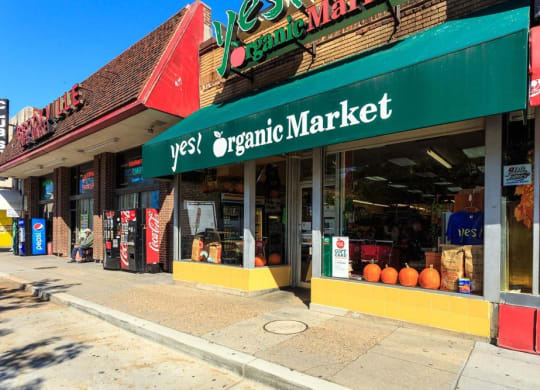 the outside of an organic market on a city street at The Saratoga Apartments, Washington, DC