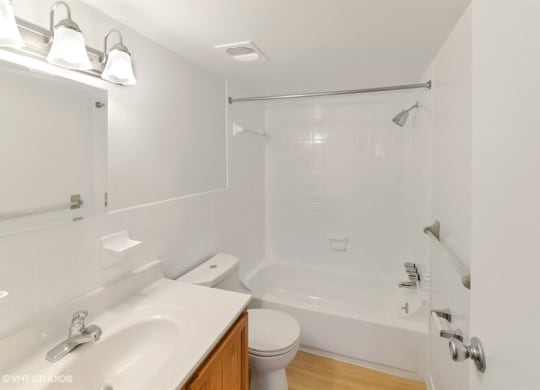 Large Soaking Tub In Primary Bathroom with A Tile Surround at The Forest, Rockville