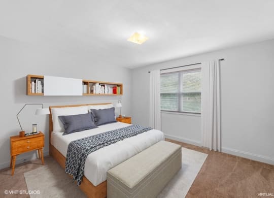 a white bedroom with a bed and a window in Croydon Manor apartment