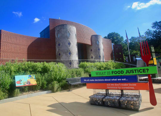 a sign in front of a building that says what is food justice