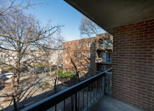 the view from the balcony of a apartment building on a sunny day