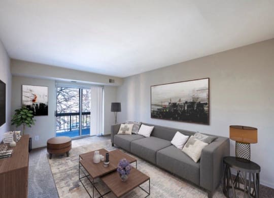 a living room with a gray couch and a table