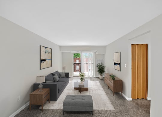 a living room with a gray couch and a coffee table