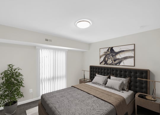 a bedroom with a bed and a plant