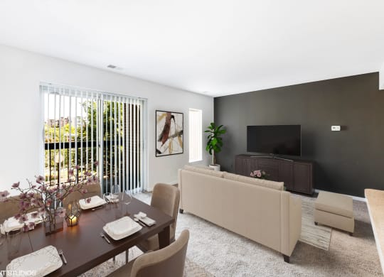 a living room with a table and a couch and a television