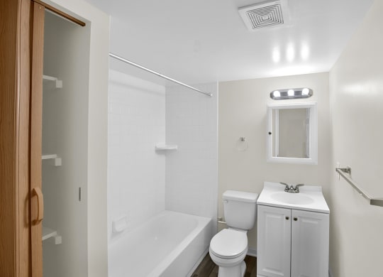 a bathroom with a sink toilet and a tub