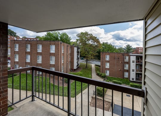 the view from the balcony of an apartment building on a sunny day