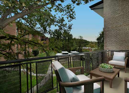 a porch with chairs and a table on a balcony