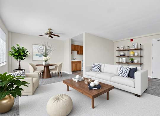 Spacious living and dining area with modern furnishings at Highland Ridge Apartments, Capitol Heights, Maryland