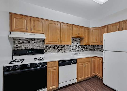 Kitchen with wooden closet at Aspen at Lake Trail, Columbia, MD
