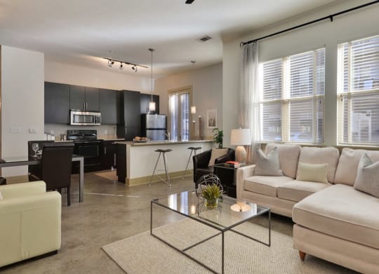 Living Room With Kitchen View at Optimist Lofts, Atlanta, GA