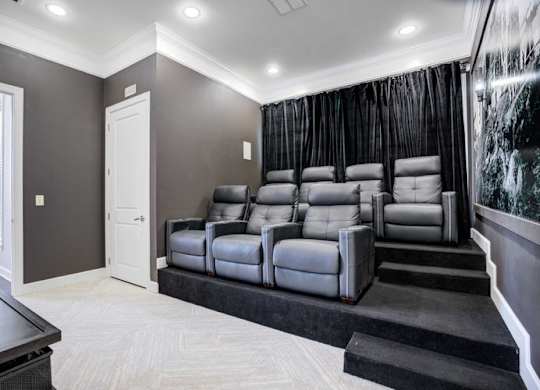 a living room with a couch and a tv at Century Lakeshore Crossings, Birmingham