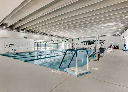 a large indoor swimming pool with a diving board at Lory of Harbison, South Carolina, 29212