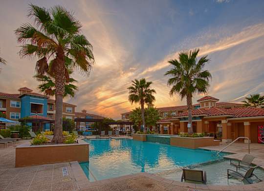 Swimming Pool With Lounge Chairs at Century South Shore Apartments, League City, 77573