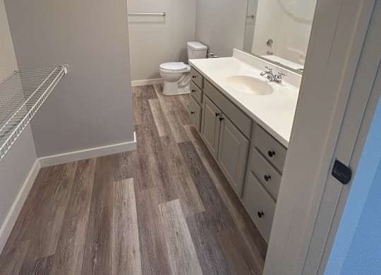 a bathroom with a sink and a shower and a toilet at Briarcliff at Quechee Apartments, Quechee, Vermont