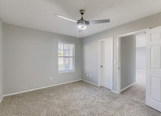 Empty Bedroom with a ceiling fan at Keita 1875, Georgia 30349