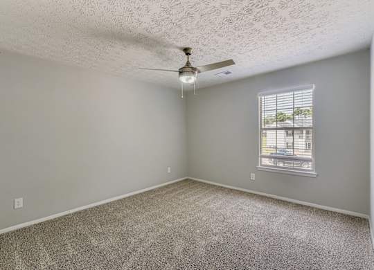 A room with a ceiling fan and a window with blinds at Keita 1875, College Park, 30349
