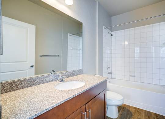 a bathroom with a toilet sink and shower  at Century Avenues, Florida