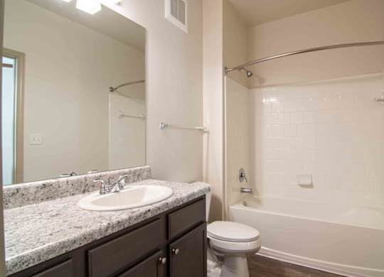 a bathroom with a sink toilet and shower at Century New Holland, Georgia