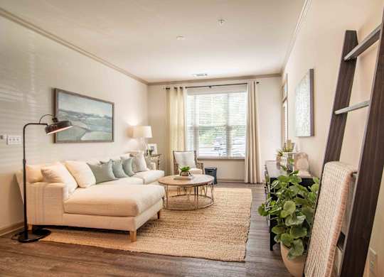 a living room with a couch and a table at Century New Holland, Gainesville, Georgia